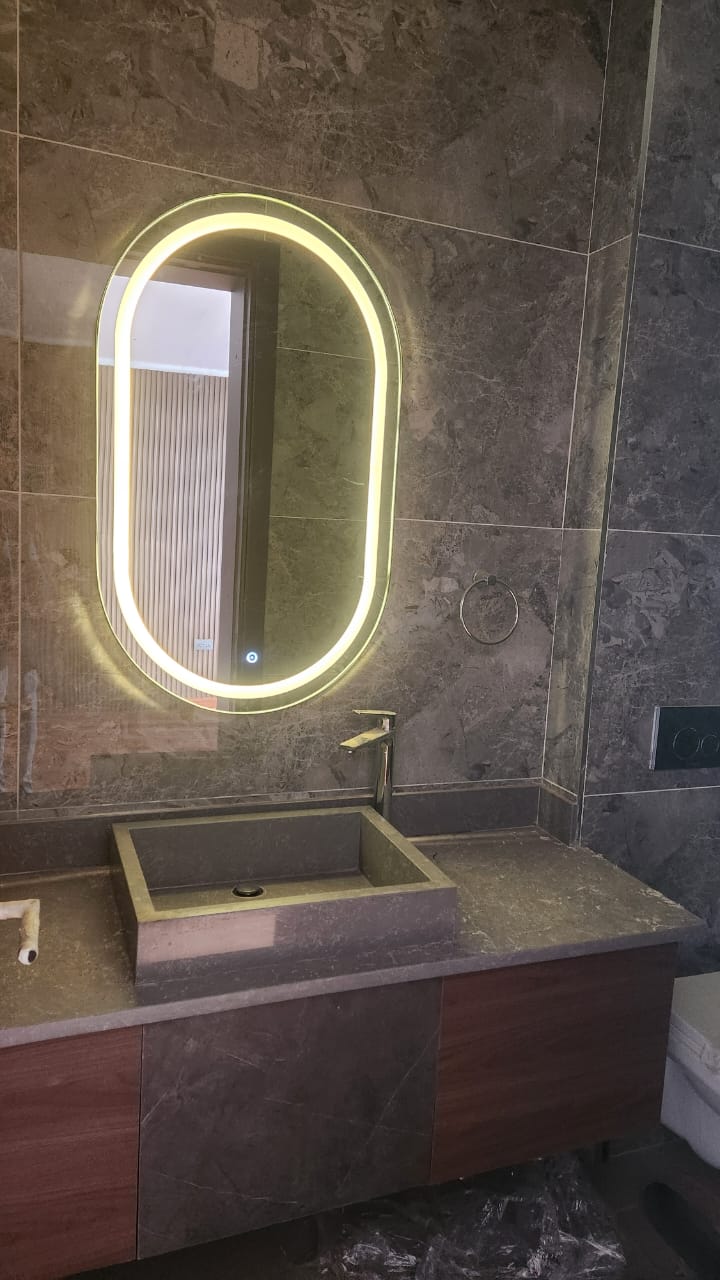 Bathroom fitout with illuminated mirror